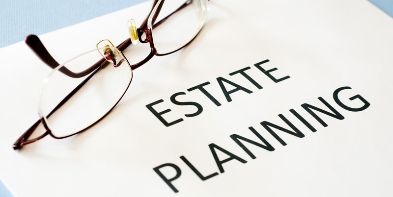 Glasses on estate planning document.