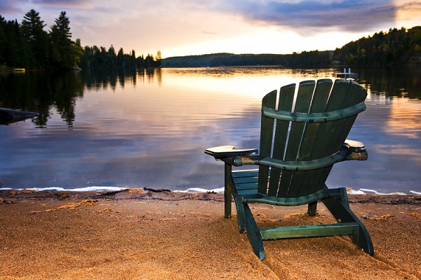 cottage chair near a lake