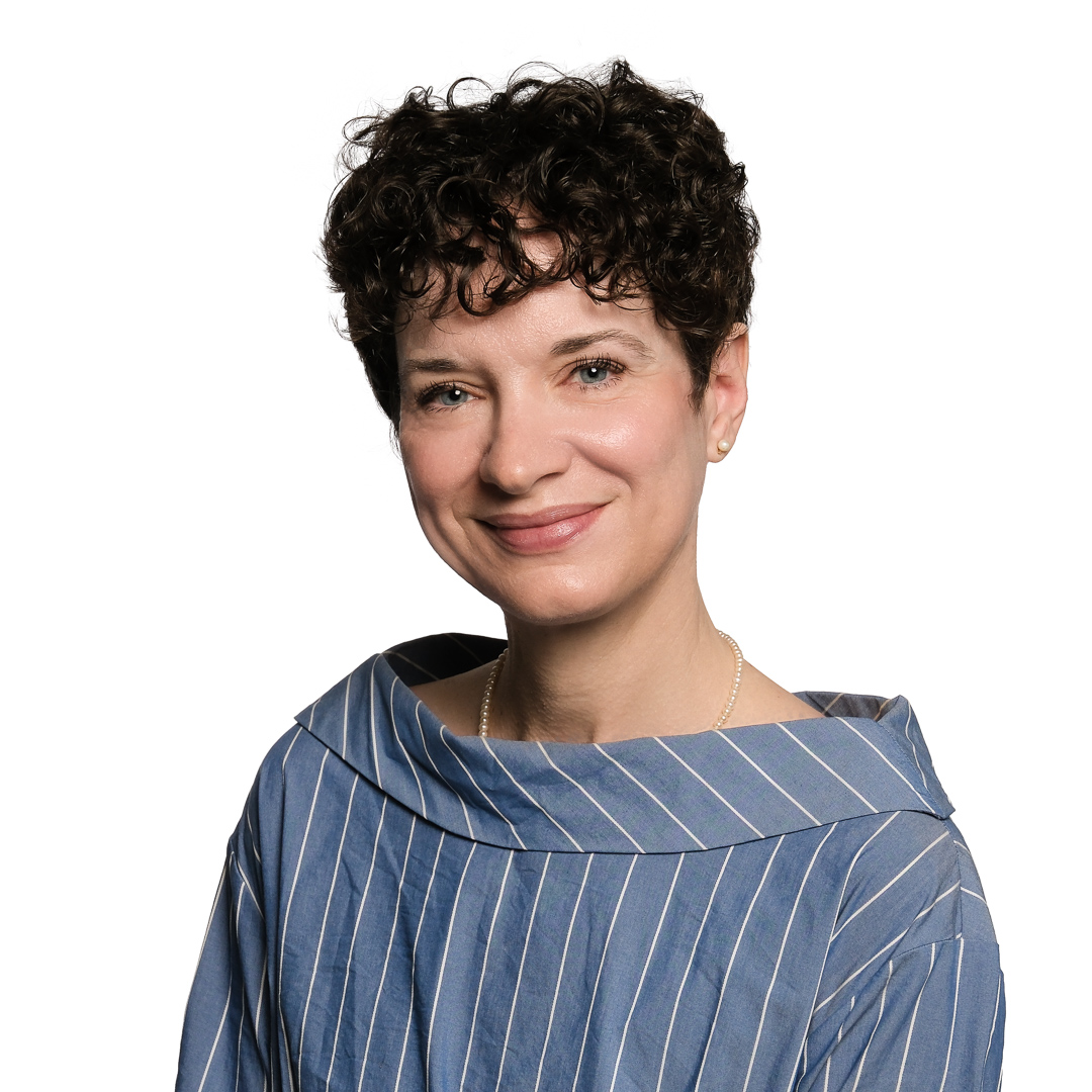 Headshot of a woman in blue dress